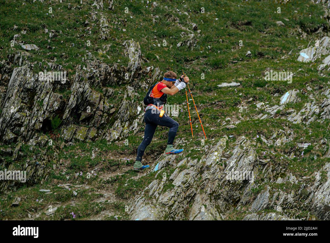 Arkhyz, Russia - July 2, 2022: male athlete walking uphill climb in Arkhyz X Run Stock Photo