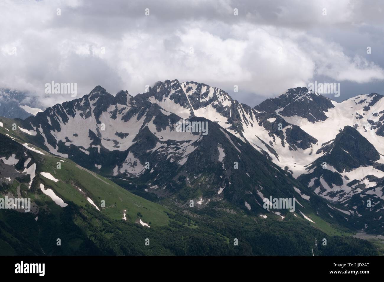 snow on mountain peak in summer in arkhyz Stock Photo
