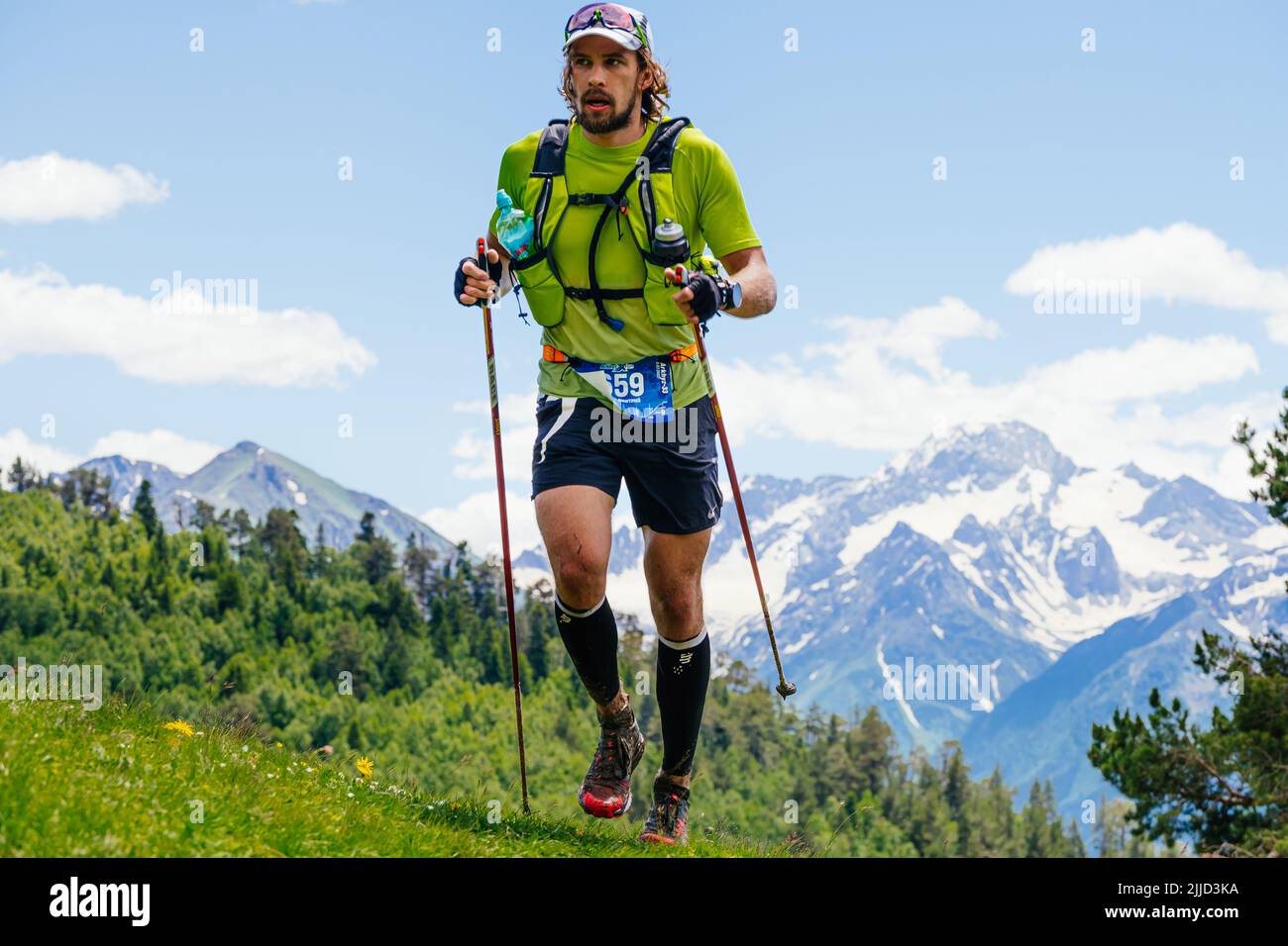 Arkhyz, Russia - July 3, 2022: male runner running mountain trail in Arkhyz X Run Stock Photo