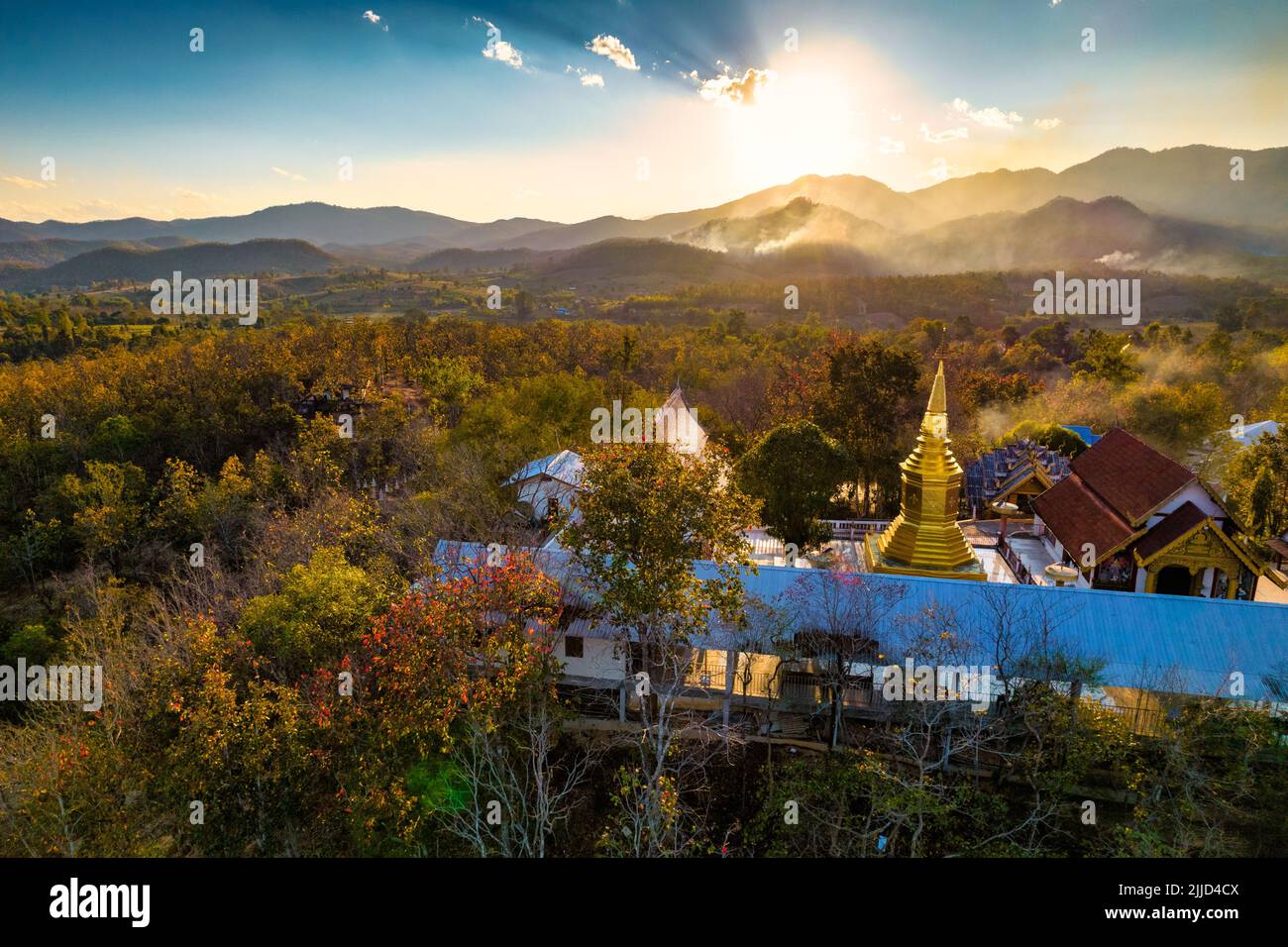 Aerial shot of the Wat Phrathat jom jaeng temple with a beautiful sunset, Pai province, Thailand Stock Photo