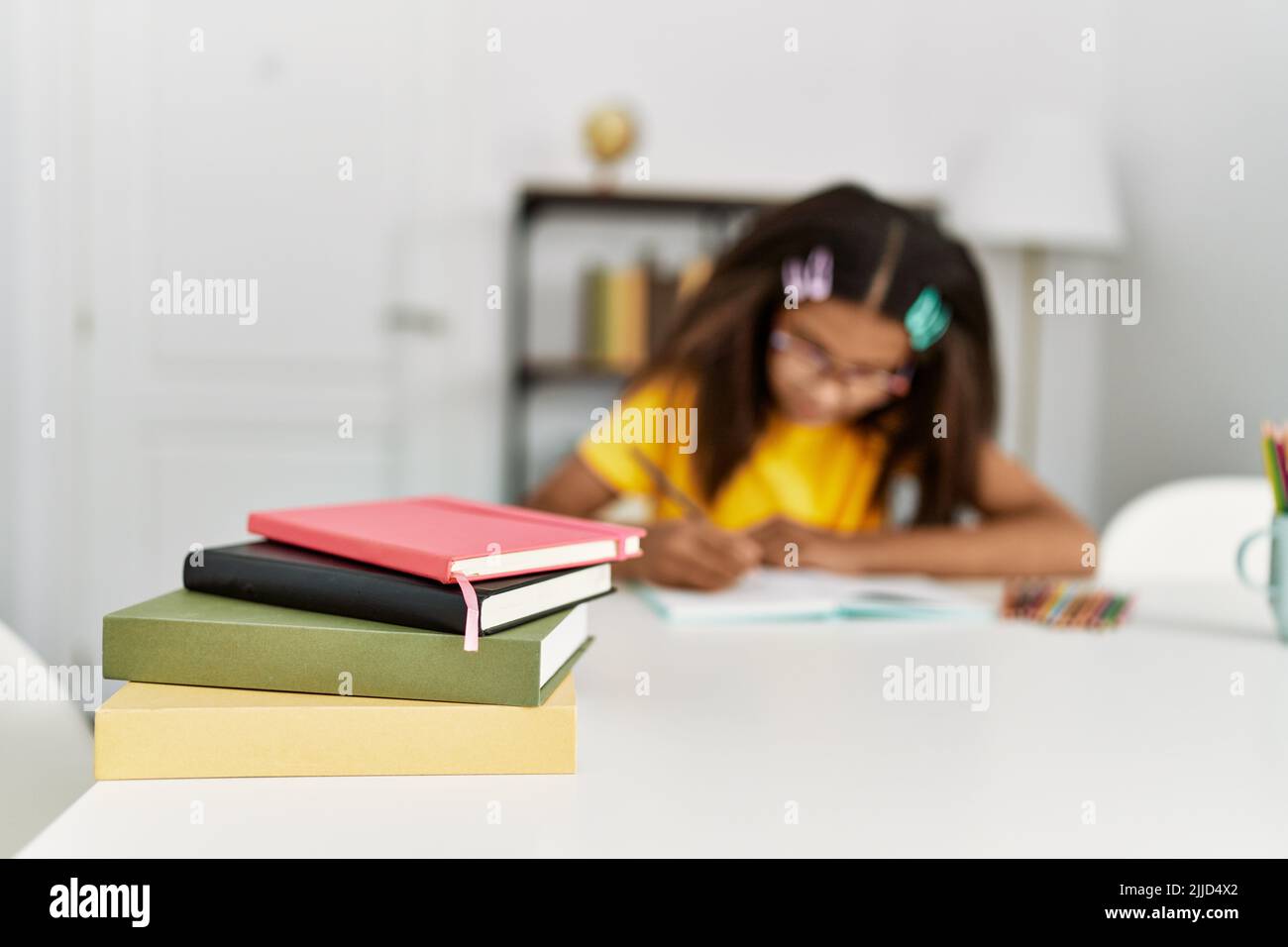 African american girl smiling confident doing school homework at home ...