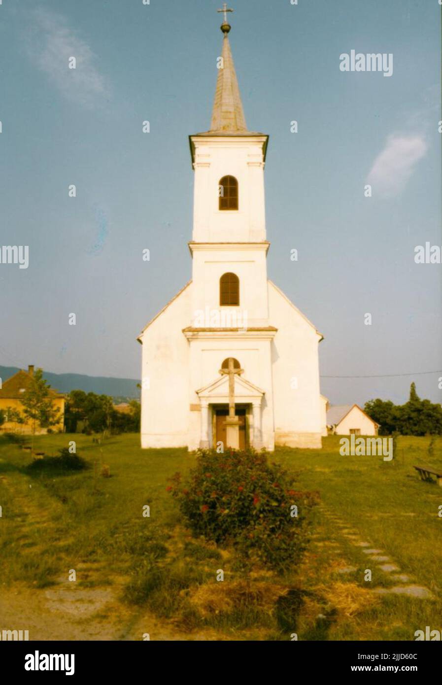 Church. In the picture the church of Bakonya can be seen with the crucifix at the entrance. (4 photos) Kistelegdi Collection István Kistelegdi, the Ybl-prize winner architect and professor emeritus of the Faculty of Engineering and Information Technology of the University of Pécs, donated his photo collection, which was made during his scholarly activities, to Csorba Gyz Könyvtár Library’s the Local History Collection of Csorba Gyz Könyvtár Library. Kistelegdi prepared the 3037 digitalized photos between 1972 and 1988 as an architectural designer of BARANYATERV and later PÉCSITERV. The collect Stock Photo