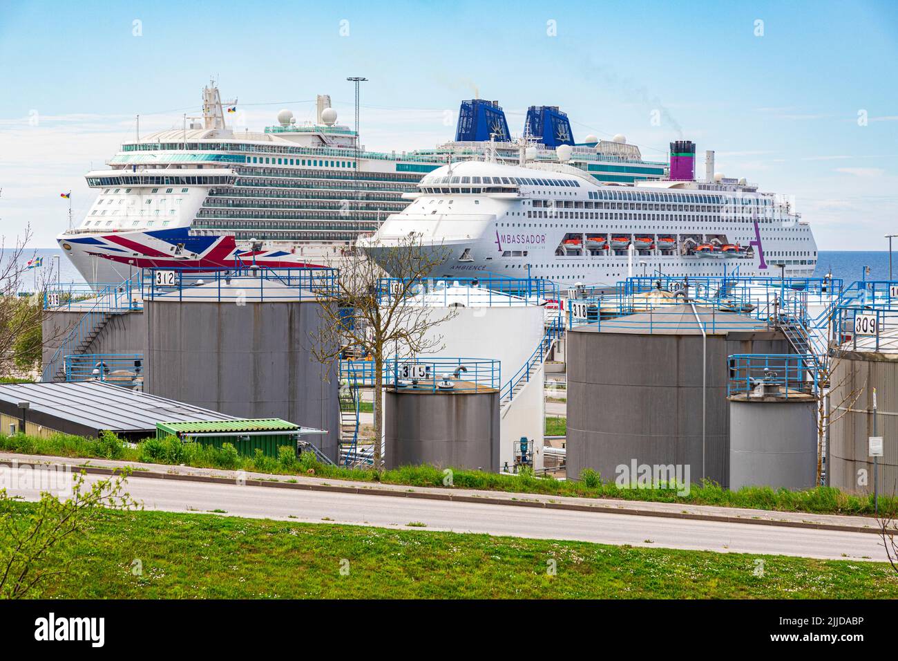 Cruise ships docked in front of fuel storage tanks at Visby on the island of Gotland in the Baltic Sea off Sweden - P&O 'Britannia' and Ambassador 'Am Stock Photo