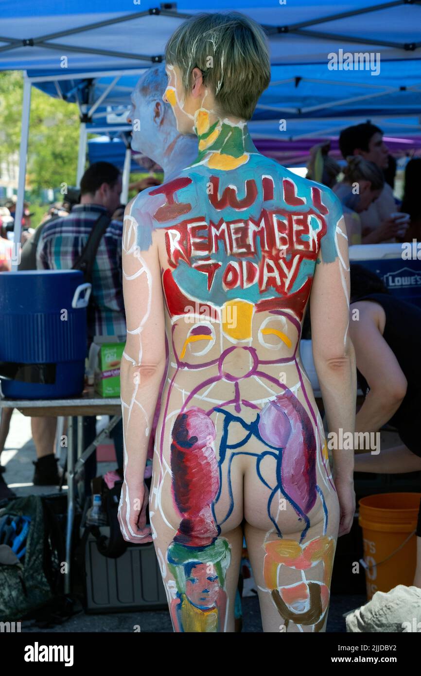 A rear view of a slender young lady at NYC Body Painting Day in Union Square Park in Lower Manhattan, New York. Stock Photo