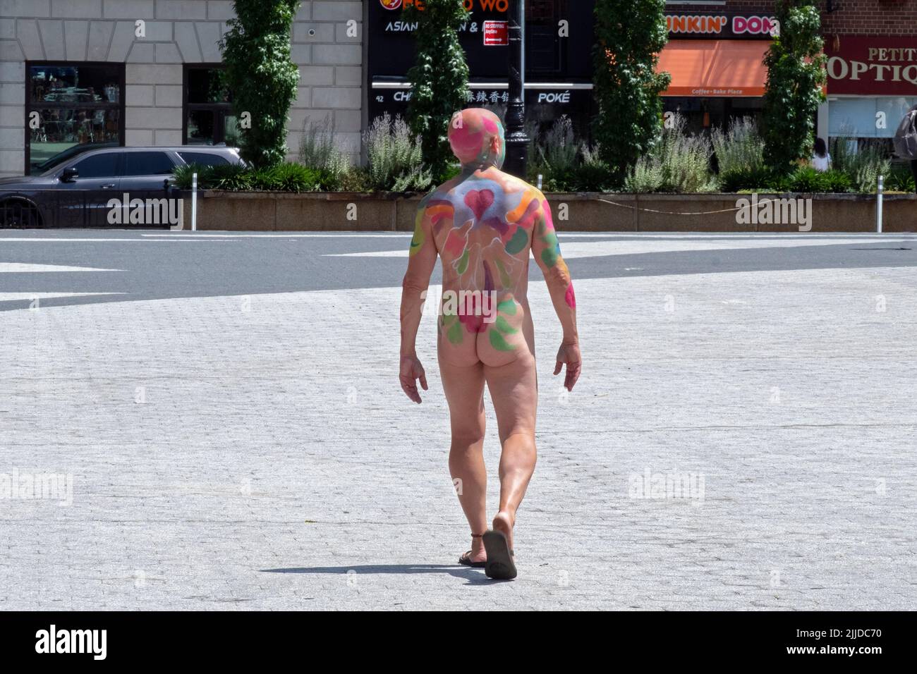 An unidentifiable man in his sixties after being painted at NYC Body Painting Day in Union Square Park in Lower Manhattan, New York. Stock Photo