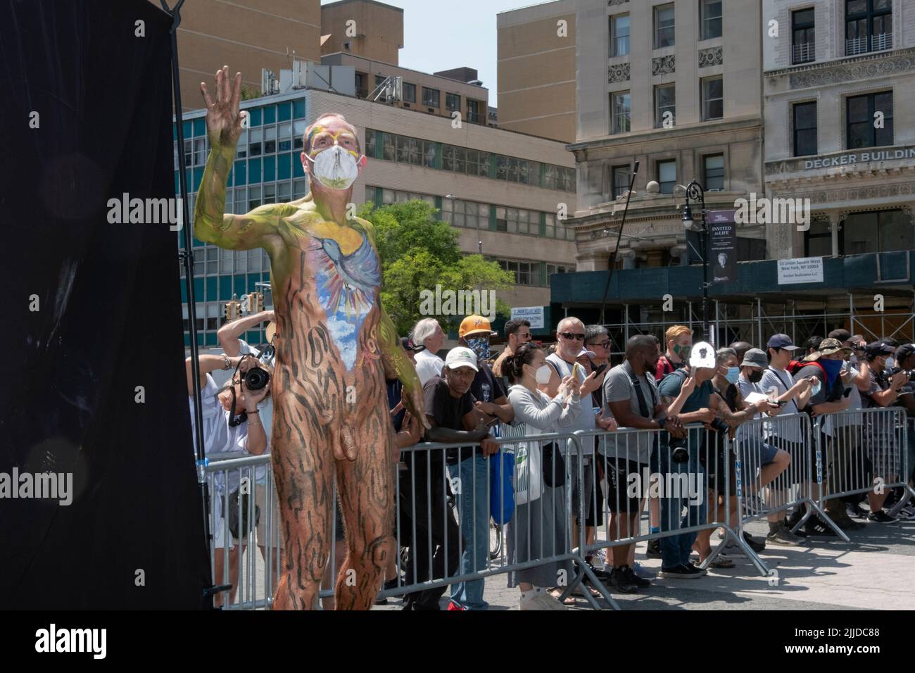 A middle aged man poses after a full body painting at an event in Union Square Park in Manhattan, New York. Stock Photo