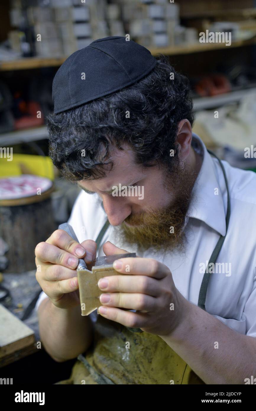 A master craftsman and rabbi makes tefillin (phylacteries) in his basement workshop in Crown Heights, Stock Photo