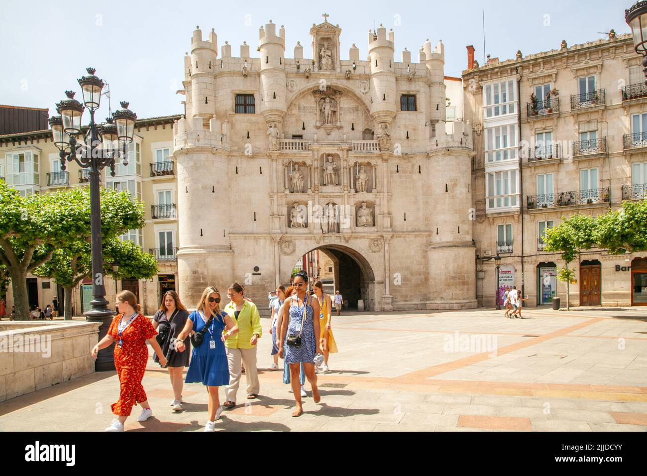 Group  women on a sightseeing tour of the Spanish city of Burgos on the bridge of Santa María outside the city gate of Santa Maria, Spain Stock Photo