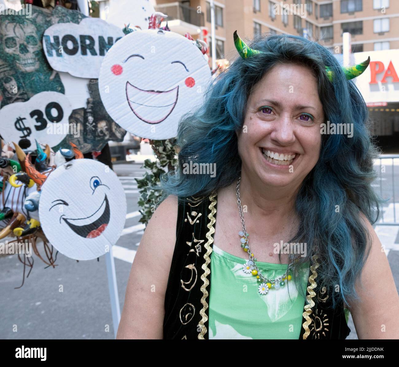 A Wiccan vendor at Witchsfest 2022 who sells items including the horns she is wearing. On Astor Place in Greenwich Village, 2022. Stock Photo