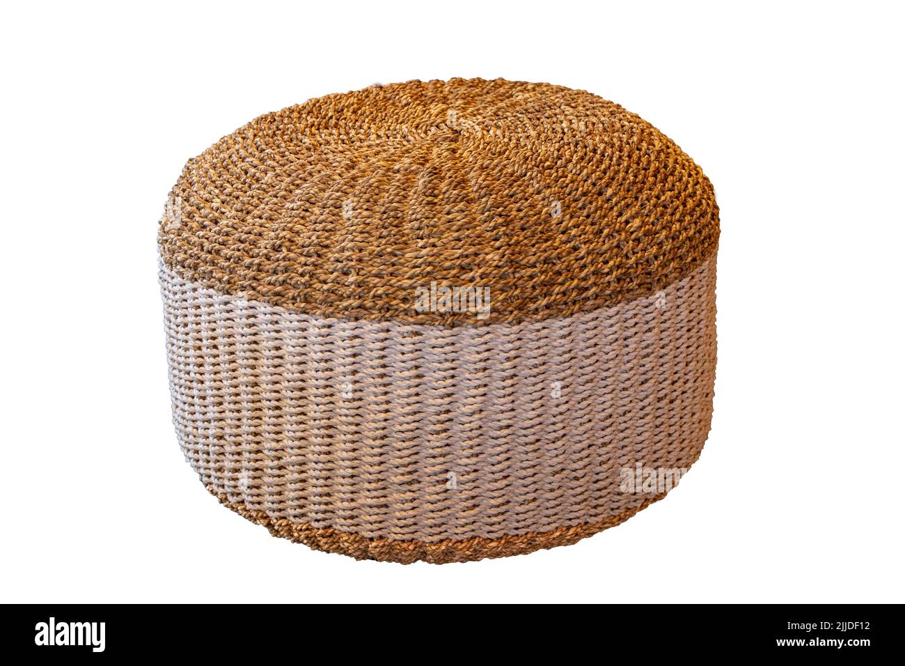 Wicker furniture. Close-up of a wickerwork stool in round shape as seating in hotels and by the pool isolated on a white background. Pool accessories. Stock Photo