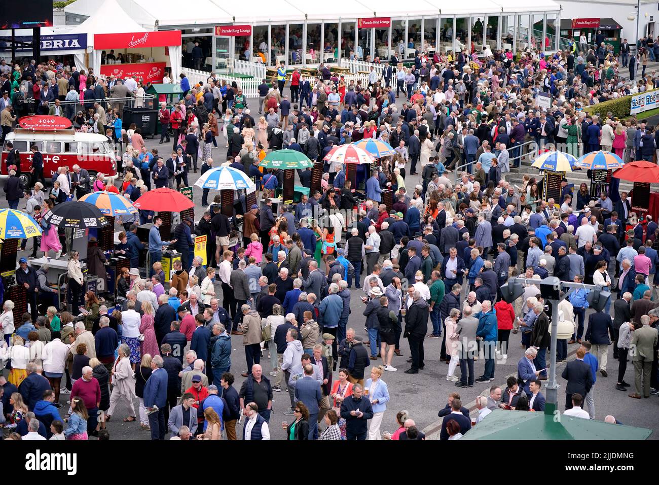 Racegoers place bets at betting stalls at the course during day one of the Galway Races Summer Festival 2022 at Galway Racecourse in County Galway, Republic of Ireland. Picture date: Monday July 25, 2022. Stock Photo