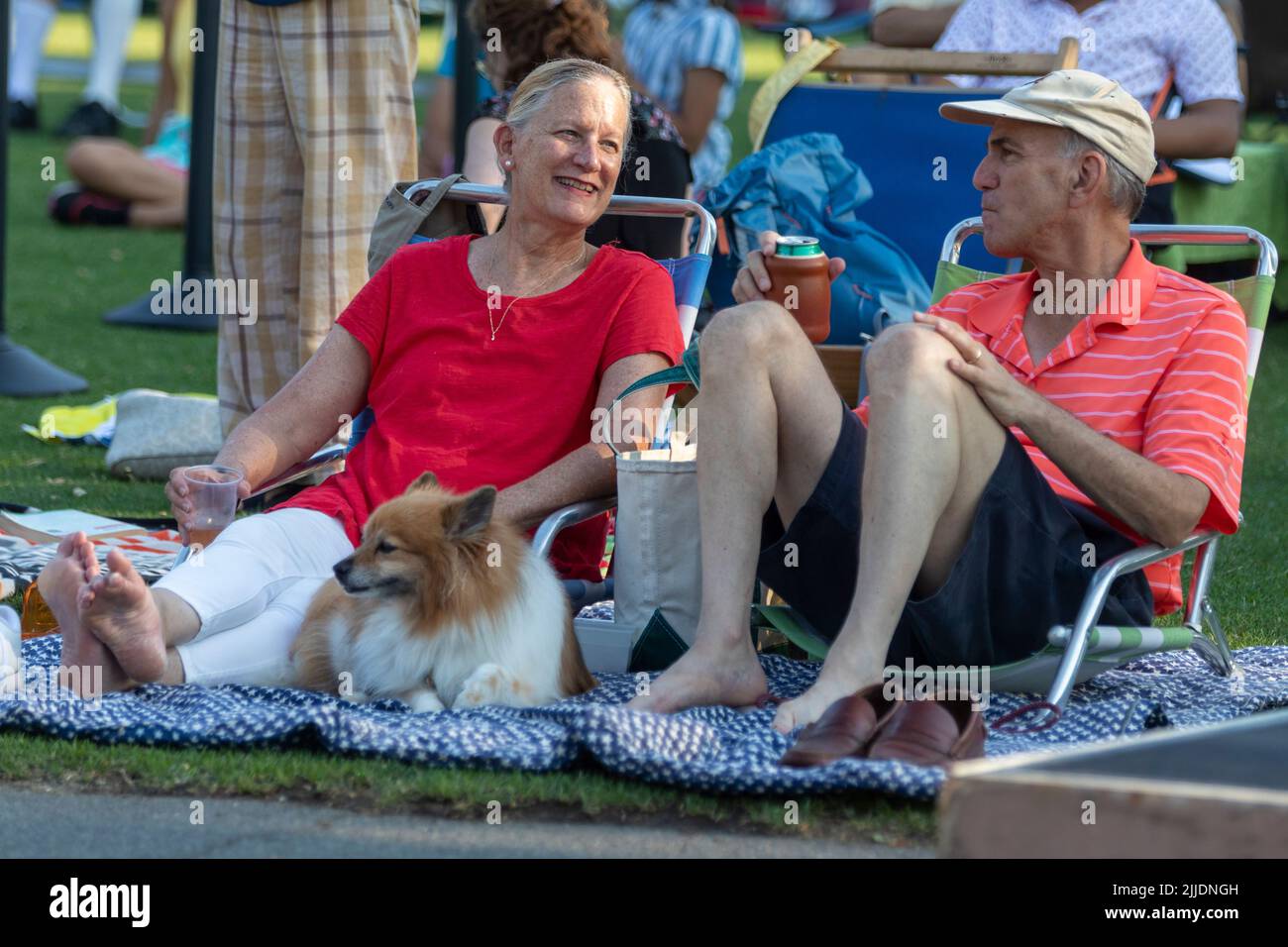 People outdoors on the Esplanade for a summer concert by the Boston Landmarks Orchestra Stock Photo