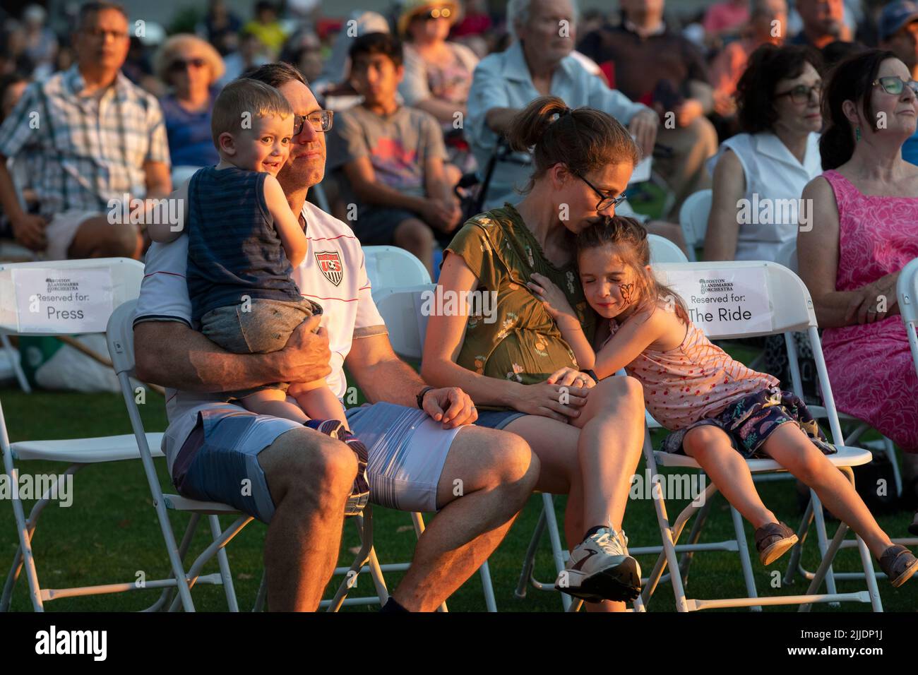 People outdoors on the Esplanade for a summer concert by the Boston Landmarks Orchestra Stock Photo