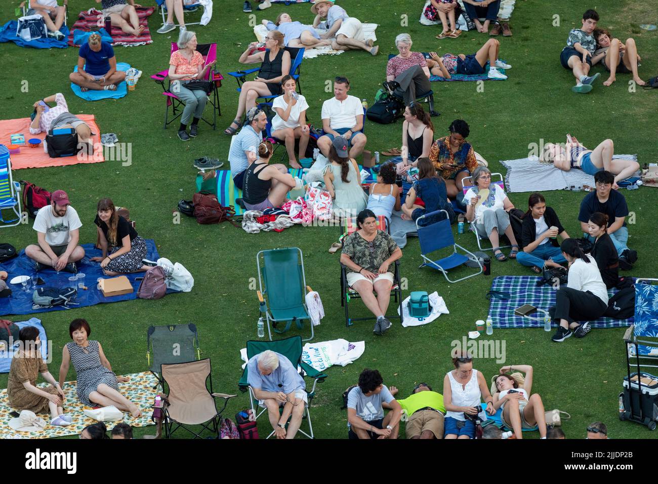 People outdoors on the Esplanade for a summer concert by the Boston Landmarks Orchestra Stock Photo