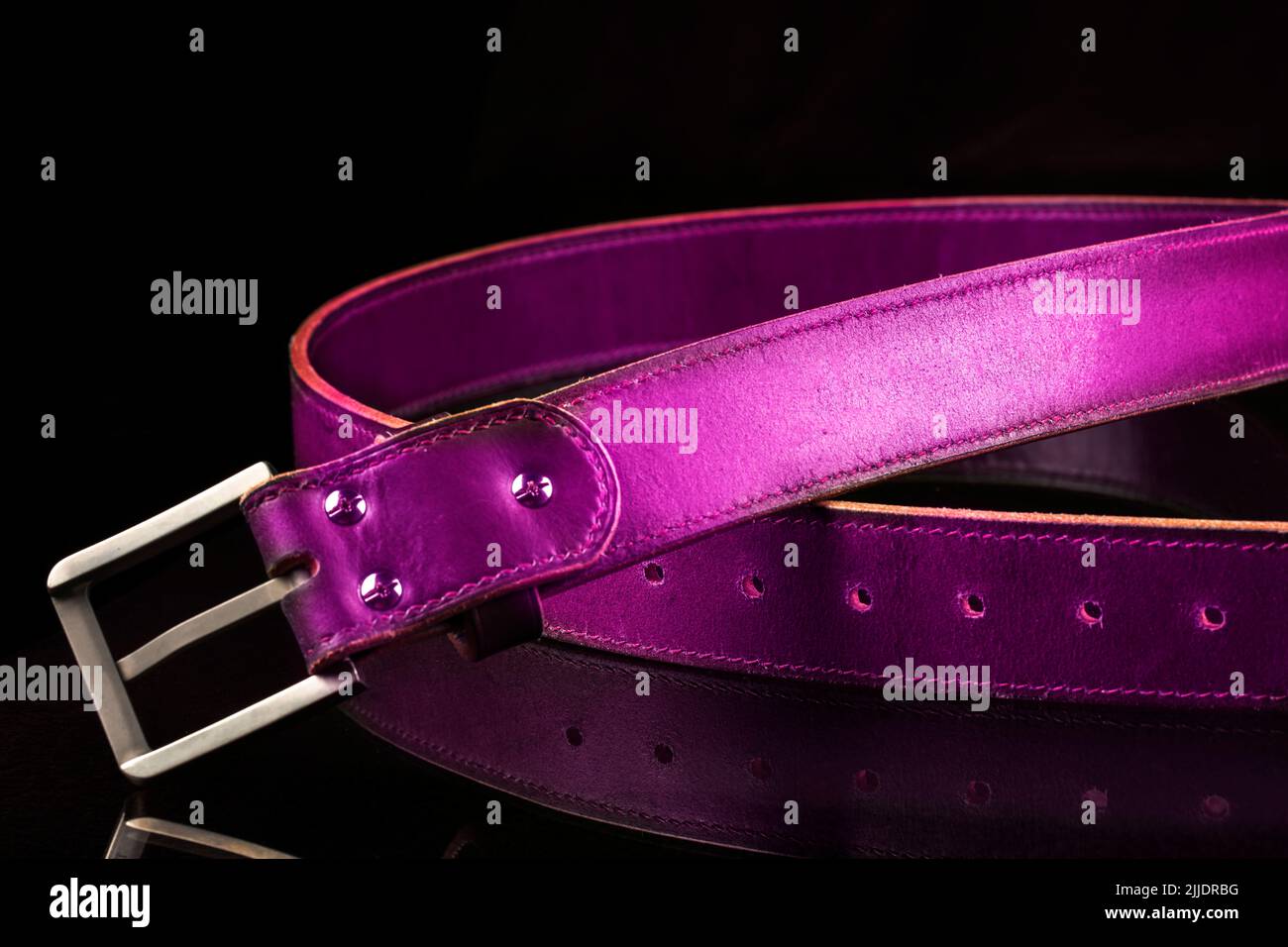 leather-pink-belt-on-a-black-background-stock-photo-alamy
