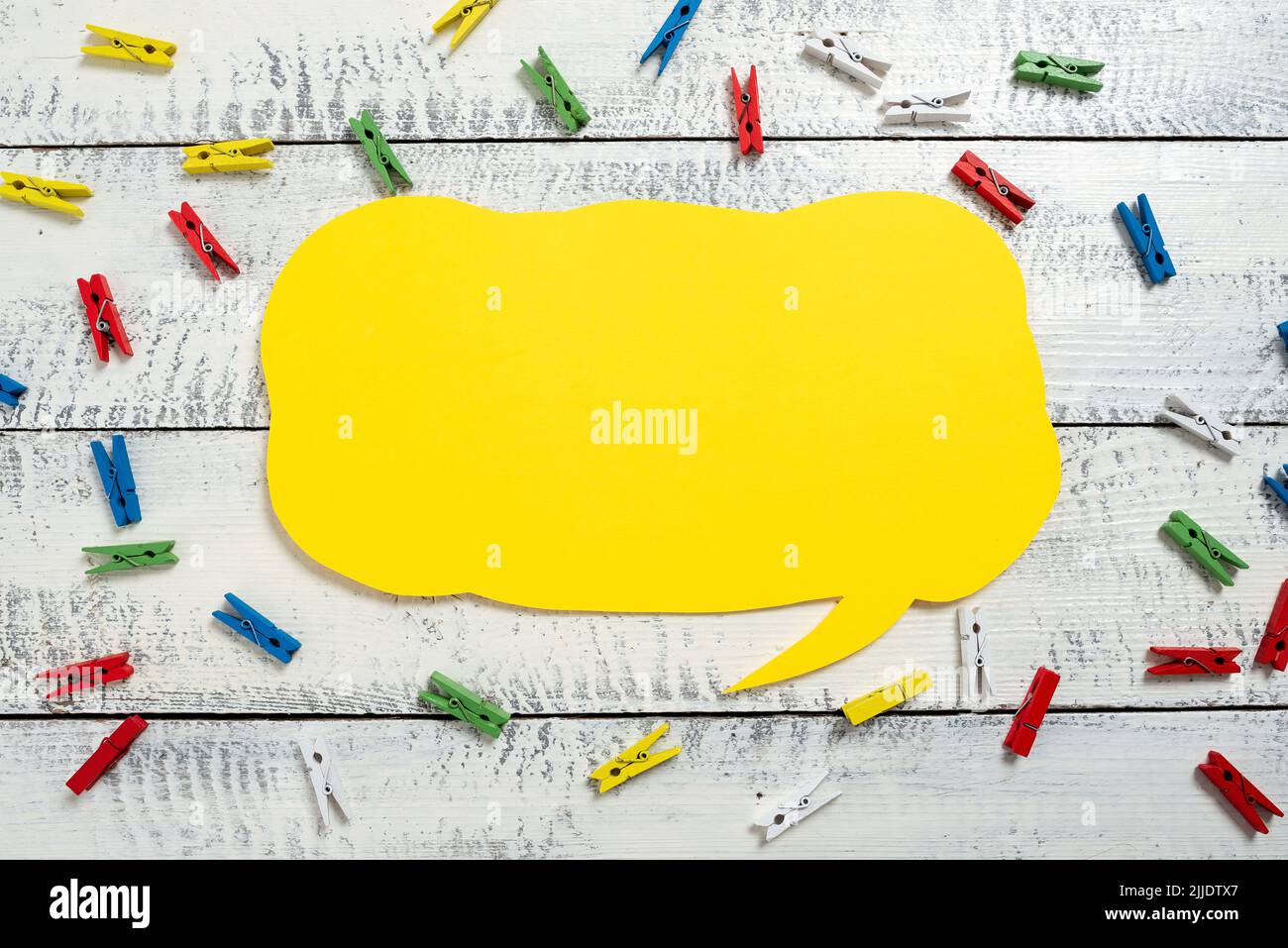 Colorful Pegs Placed Around Speech Bubble With Important Information. Stock Photo