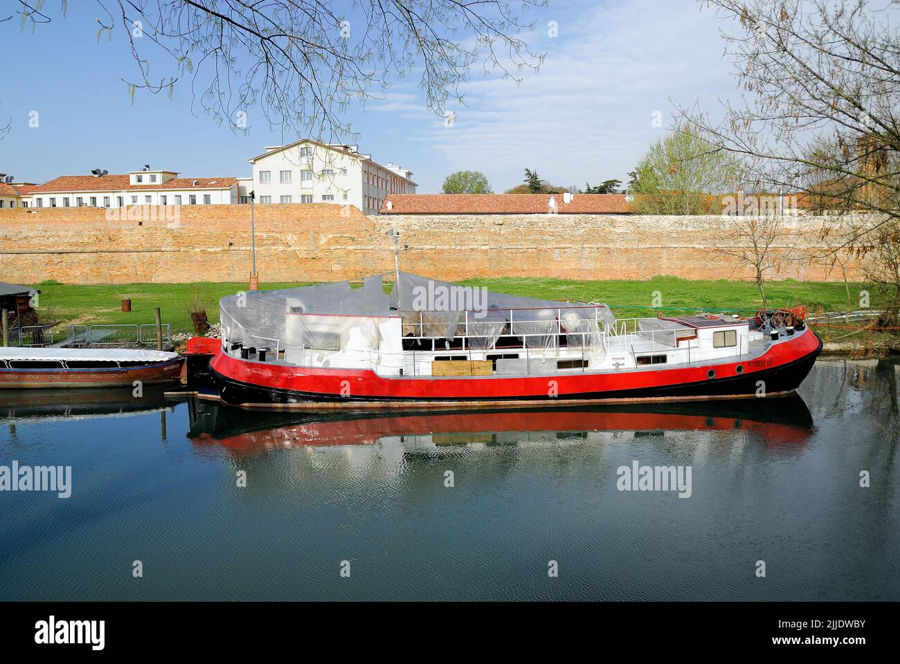 Padua, Veneto, Italy. A cargo boat in golena San Massimo. Stock Photo