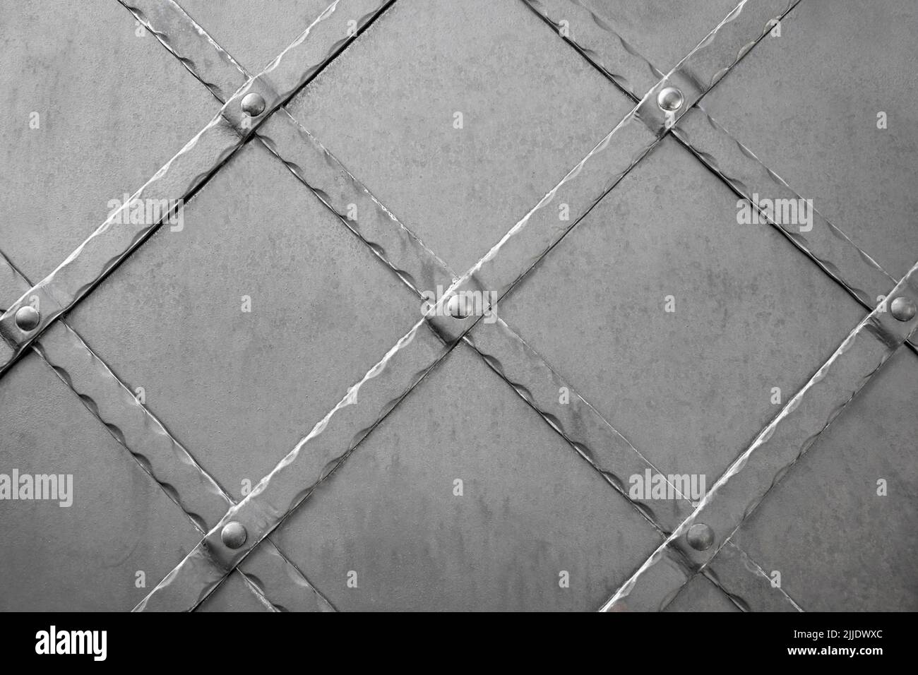 Surface of old black metal door. Decoration doors with wrought