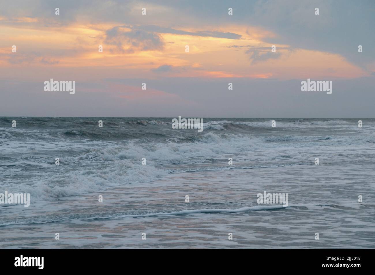 Sunset and ocean waves, Holden Beach. North Carolina, United States