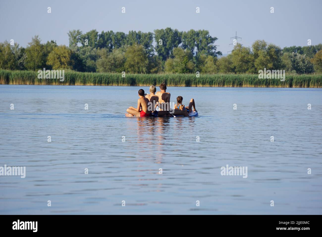 A standup paddle board with four sitting people in Oberhausen
