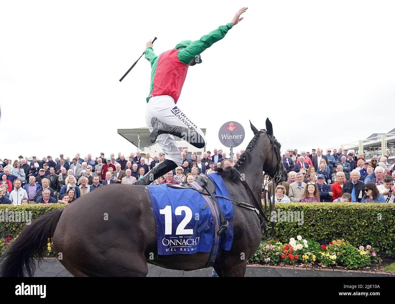 Jockey Patrick Mullins jumps off Echoes In Rain after winning the Connacht Hotel (Q.R.) Handicap during day one of the Galway Races Summer Festival 2022 at Galway Racecourse in County Galway, Republic of Ireland. Picture date: Monday July 25, 2022. Stock Photo