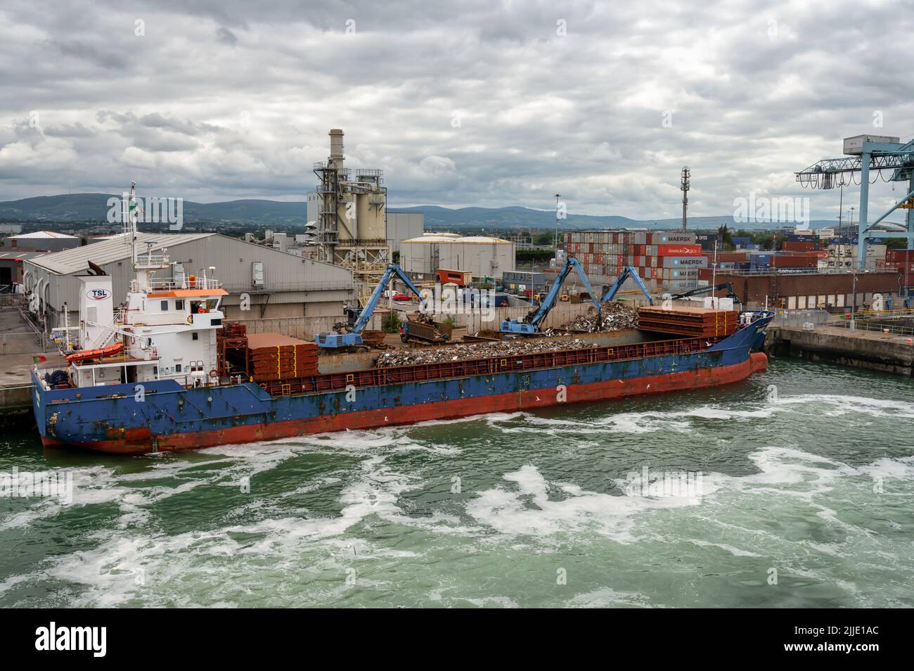 Dublin, Ireland- July 7, 2022: Scrap metal getting loaded onto a ship in Dublin Port Stock Photo