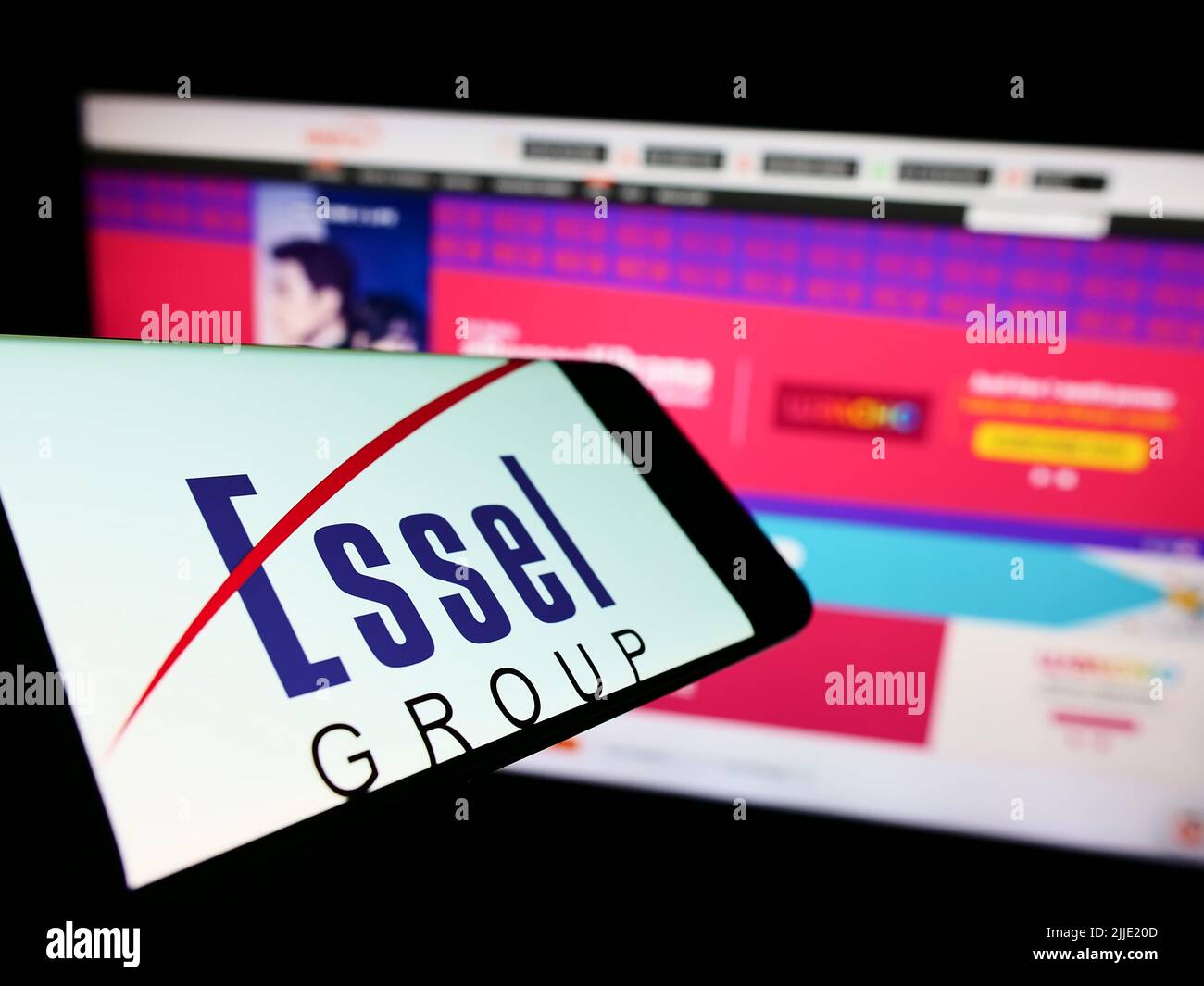 Mobile phone with business logo of Indian media company Essel Group on