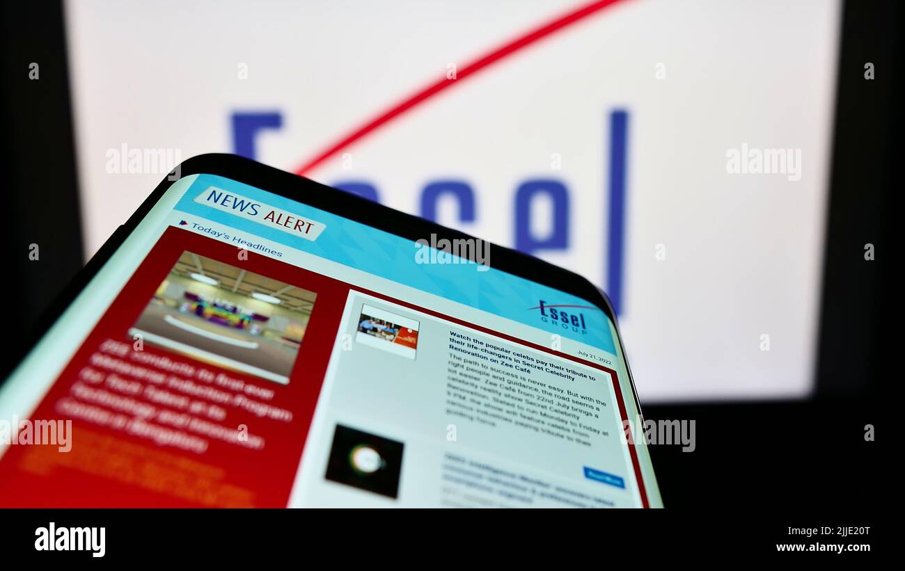 Smartphone with website of Indian media company Essel Group on screen