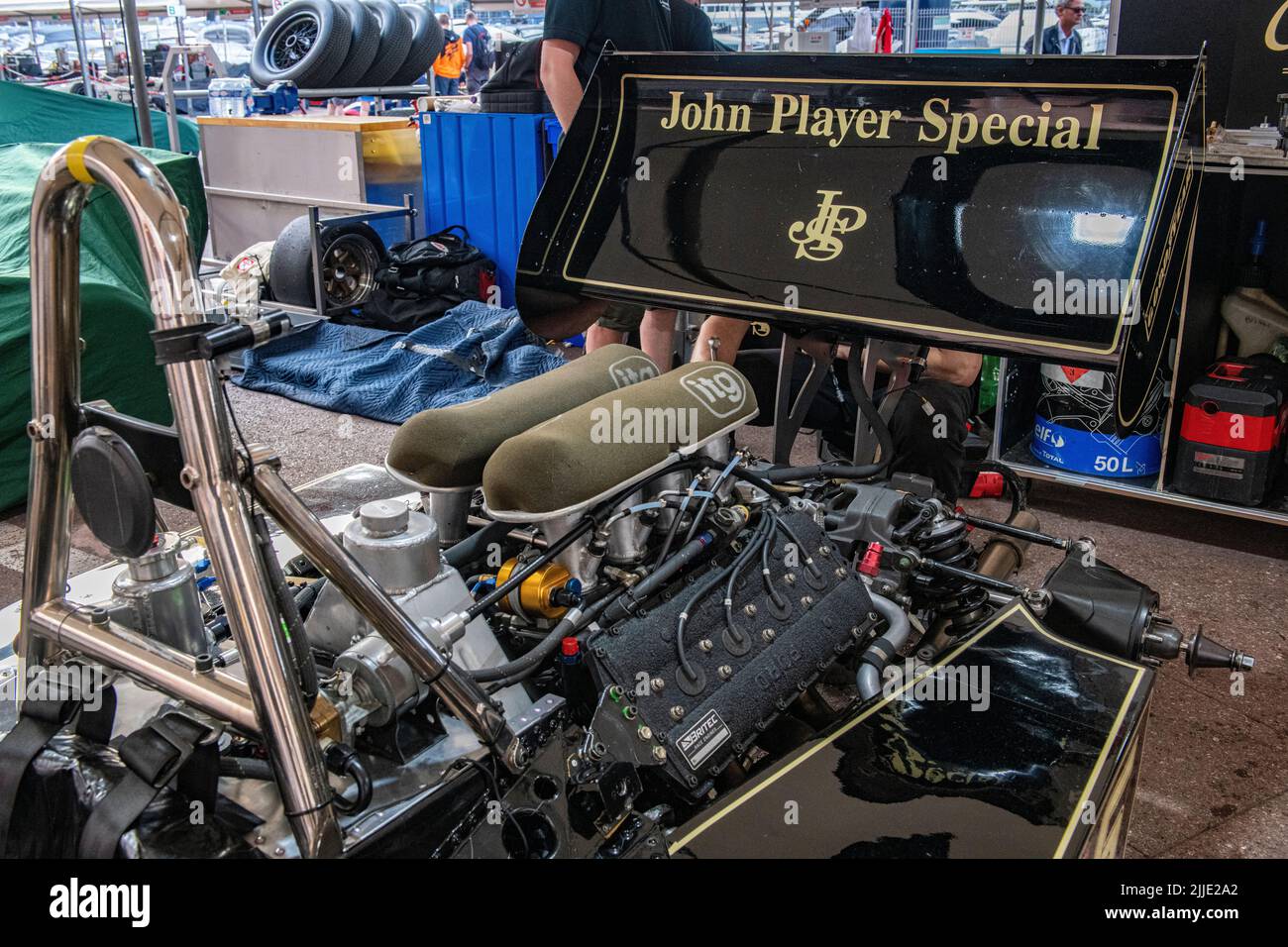 The famous black and gold JPS Lotus Formula 1 cars n the pits of the historic Grand Prix in Monaco Stock Photo