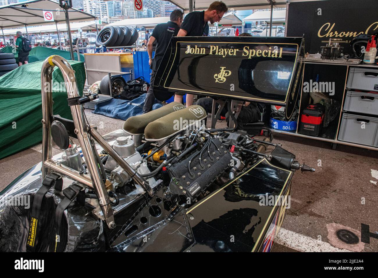 The famous black and gold JPS Lotus Formula 1 cars n the pits of the historic Grand Prix in Monaco Stock Photo