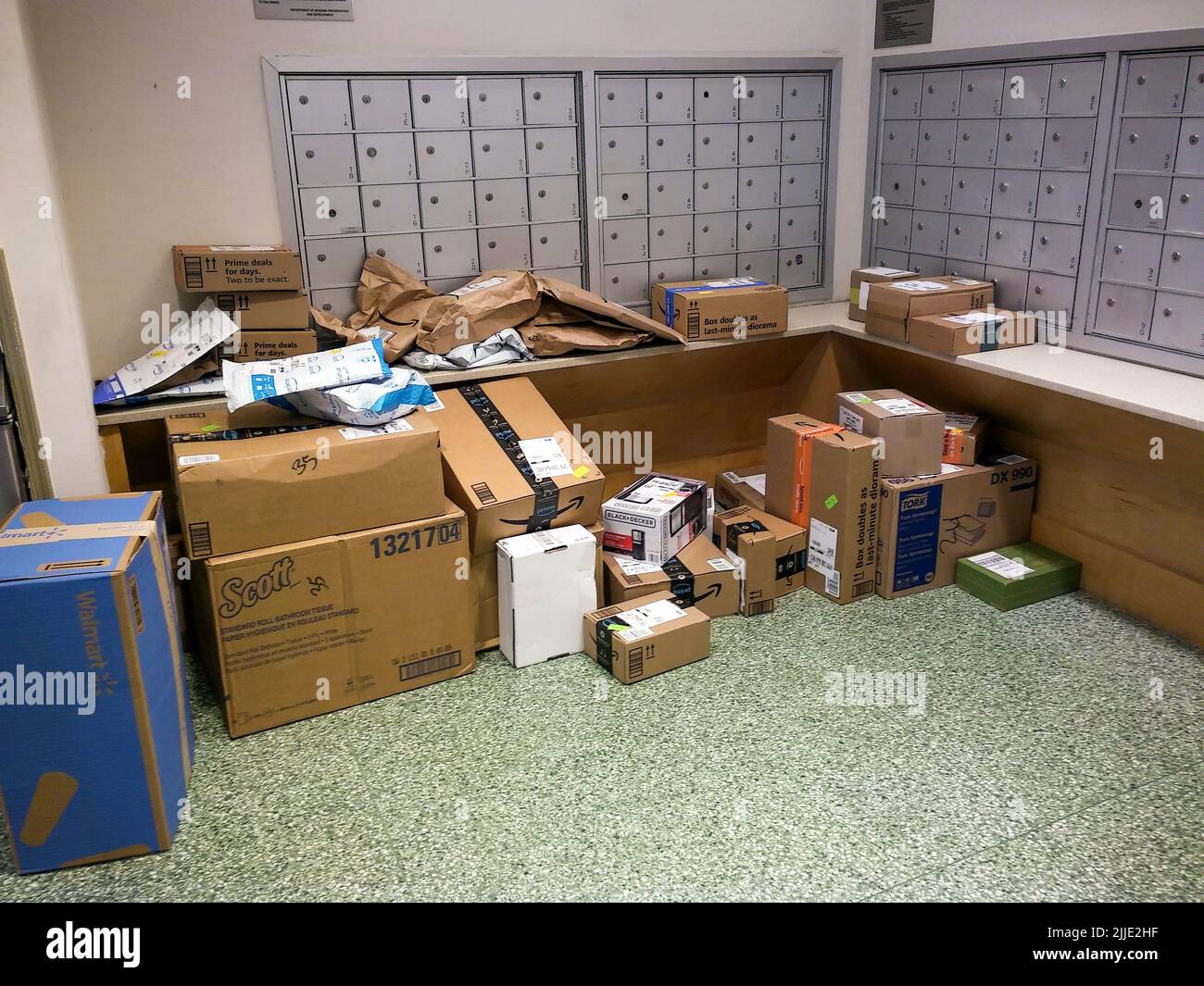 The largesse of online shopping is strewn across the mailbox area in an apartment building in New York on Thursday, July 14, 2022. (© Richard B. Levine) Stock Photo