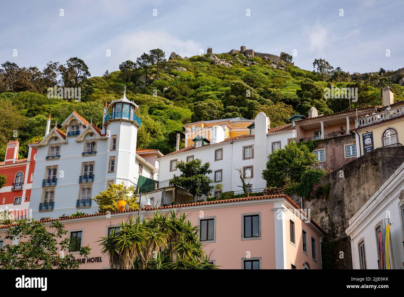 View over the houses of Sintra up to the castle fortress of Castelo dos Mouros in the forest above the town, Portugal Stock Photo