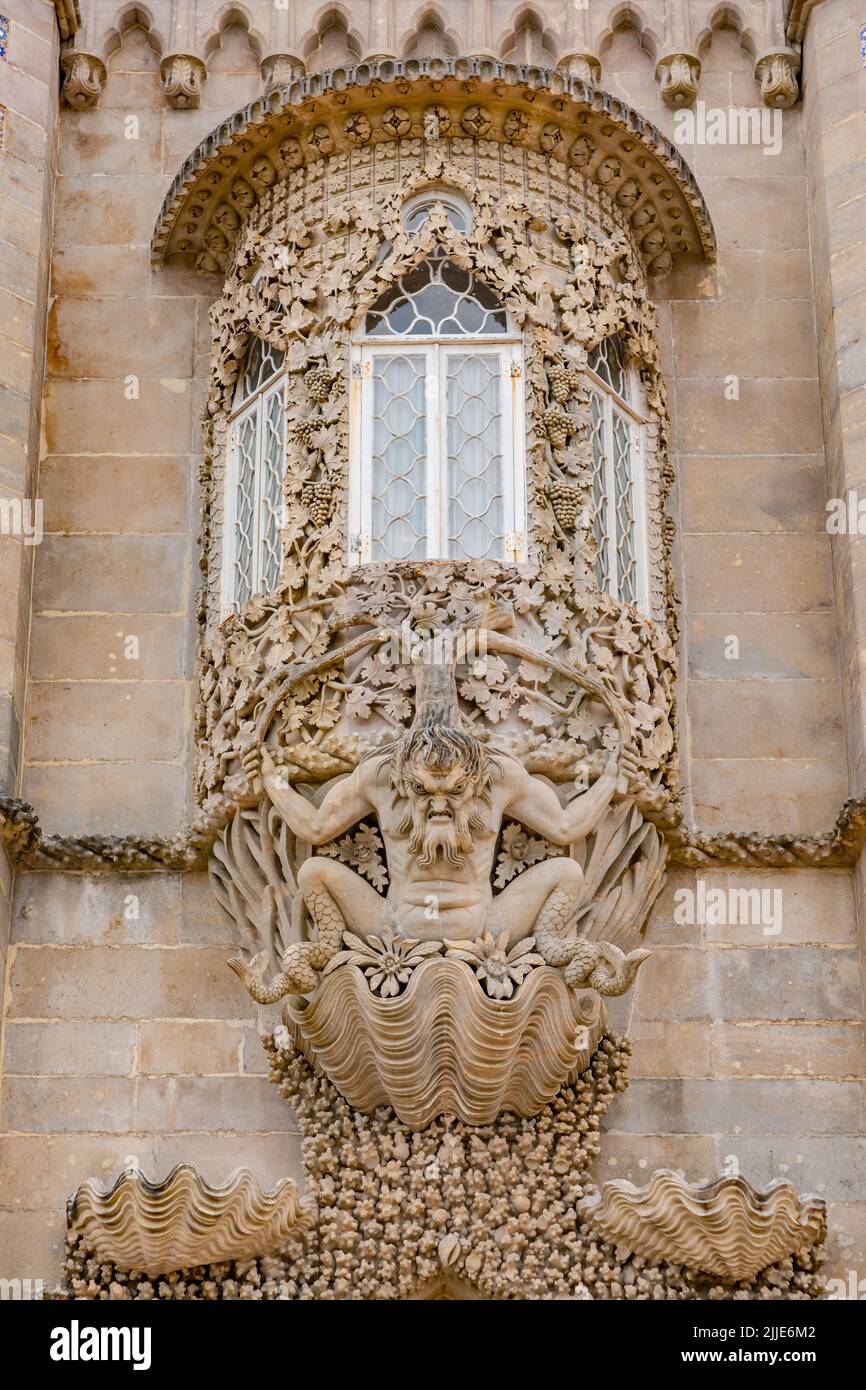 A round and ornate bay window on the facade of the Palacio Nacional da Pena above the town of Sintra, Portugal Stock Photo