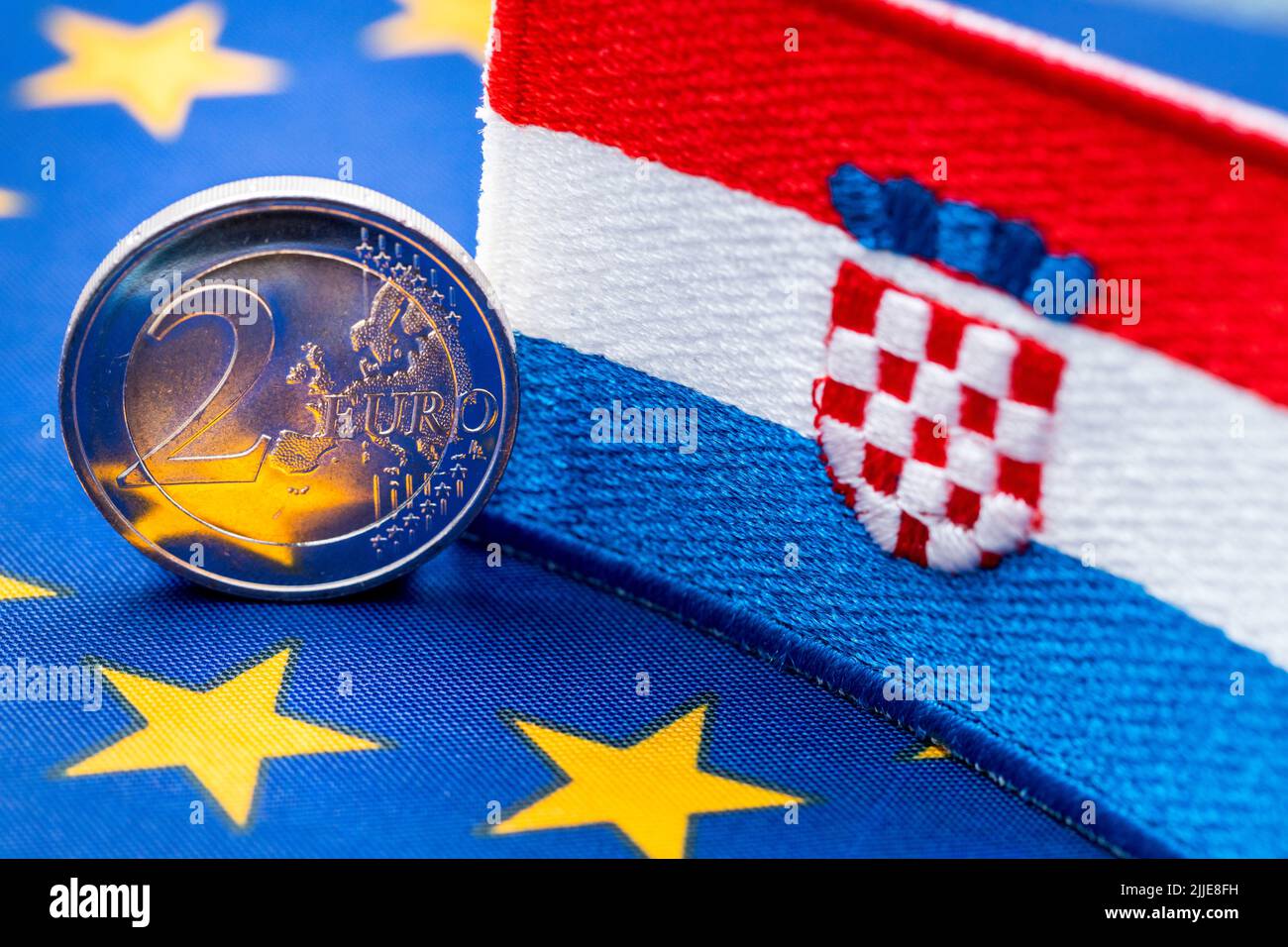 The flag of Croatia against the background of the single currency of the European Union, The concept of Croatia joining the Euro zone,  economic and p Stock Photo