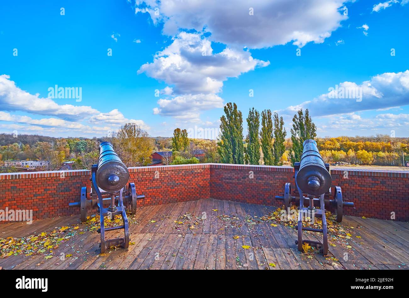 Renovated brick rampart of Chernihiv Dytynets citadel with two historic cannons, Chernihiv, Ukraine Stock Photo