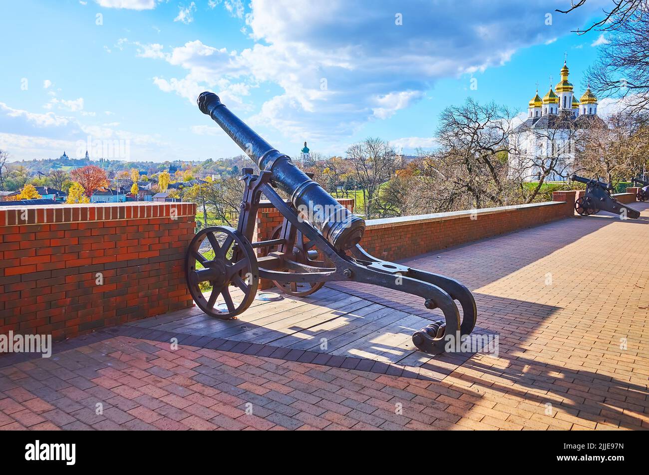 Walk along the vintage cannons, decorating the citadel wall of Chernihiv Dytynets Park, Chernihiv, Ukraine Stock Photo