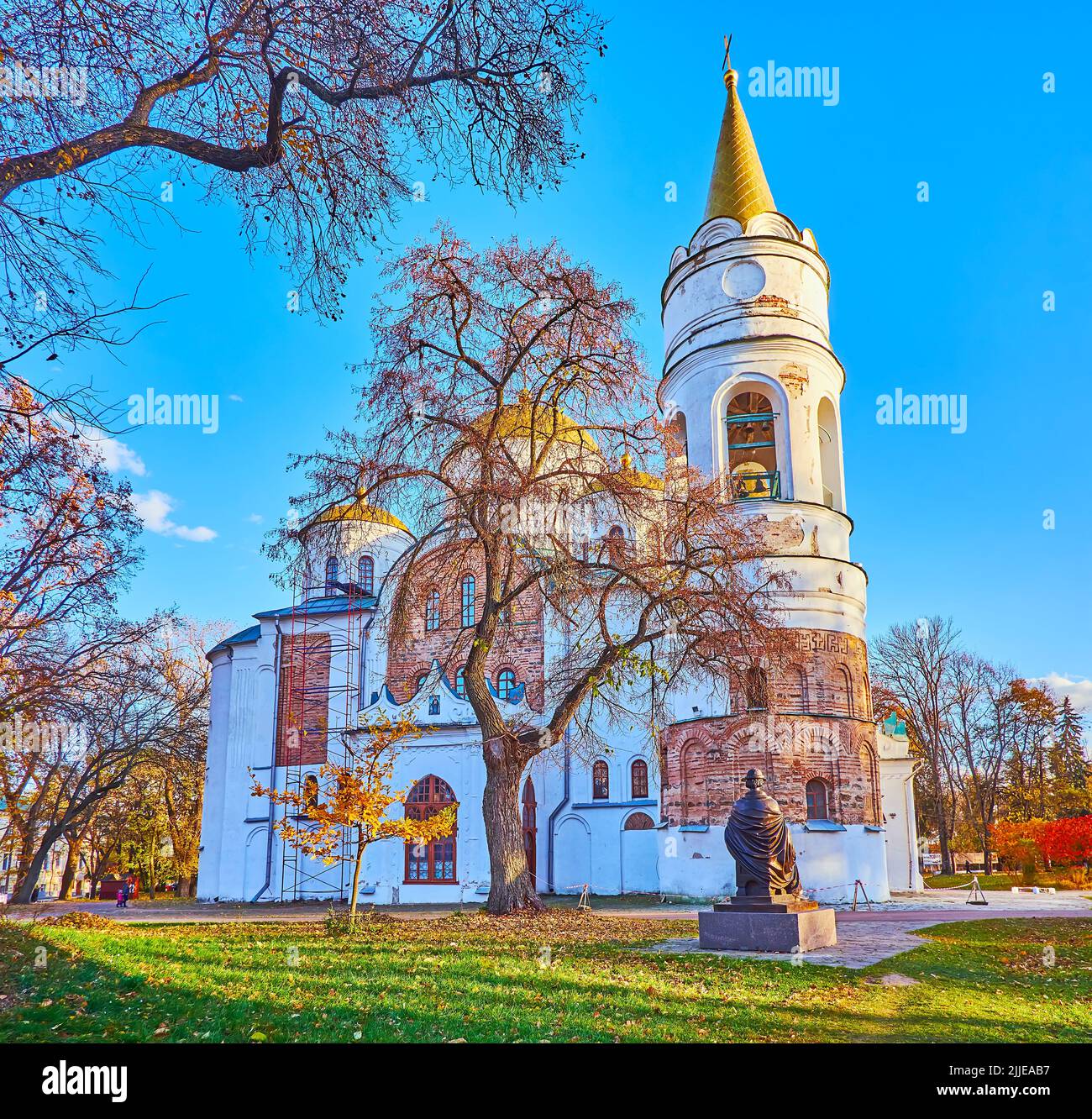 The colored autumn plants around the medieval Transfiguration Cathedral, located in Chernihiv Dytynets (Chernigov Citadel) Park, Chernihiv, Ukraine Stock Photo