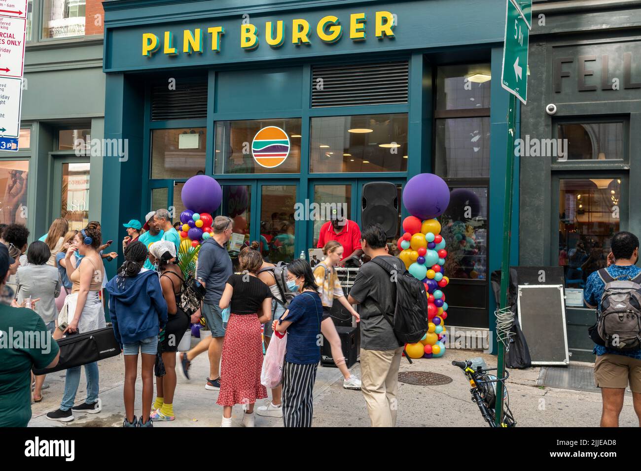 Hundreds line up at the opening of a branch of the PLNT Burger meatless