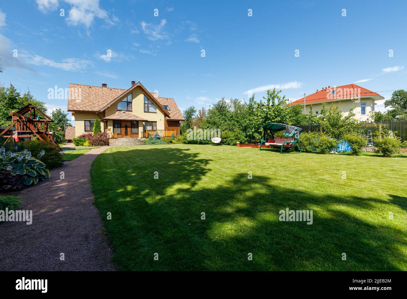 Photo of a chic country house on a sunny day Stock Photo - Alamy