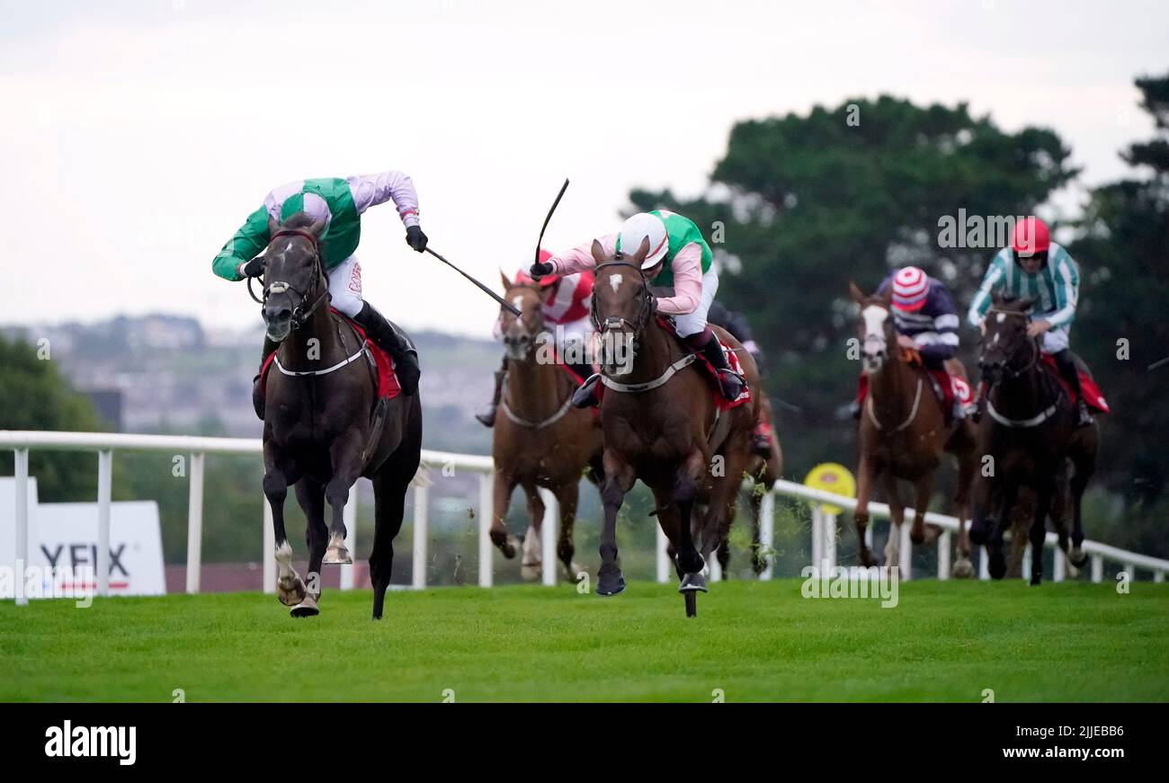 This Songisforyou ridden by jockey Derek O'Connor (left) on their way to winning the Monami Construction INH Flat Race during day one of the Galway Races Summer Festival 2022 at Galway Racecourse in County Galway, Republic of Ireland. Picture date: Monday July 25, 2022. Stock Photo