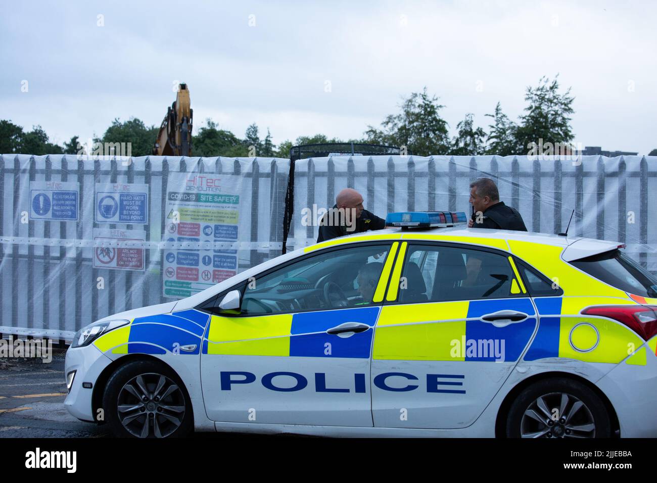 25.7.2022 Oldham Greater Manchester A strong police presence in force at the Bismark House Mill where human remains have been found at the site of the Oldham warehouse fire. Stock Photo
