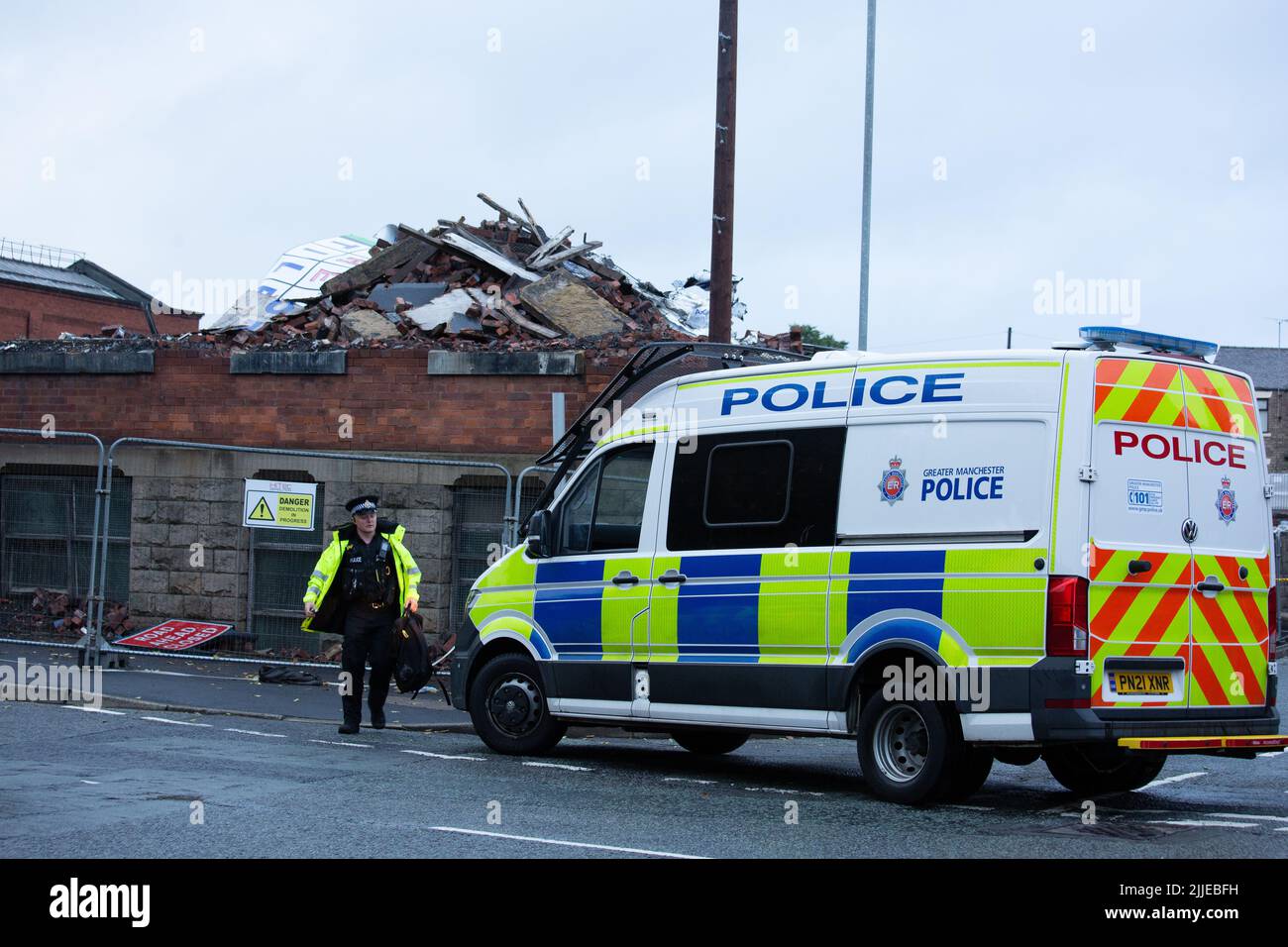 25.7.2022 Oldham Greater Manchester A strong police presence in force at the Bismark House Mill where human remains have been found at the site of the Oldham warehouse fire. Stock Photo