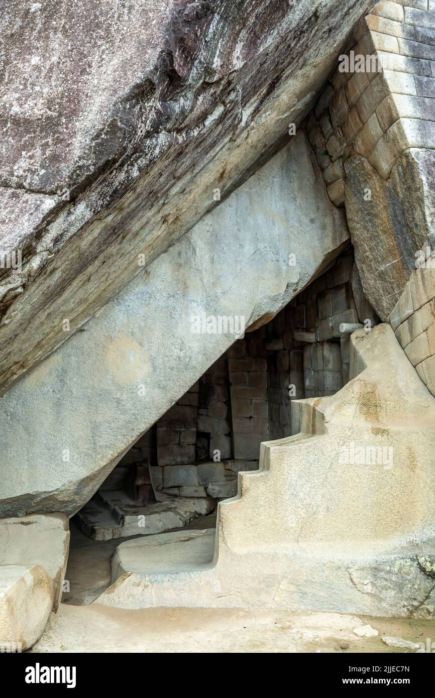 Carved steps under the Temple of the Sun, Machu Picchu Inca ruins, near Aguas Calientes, aka Machu Picchu Pueblo, Cusco, Peru Stock Photo