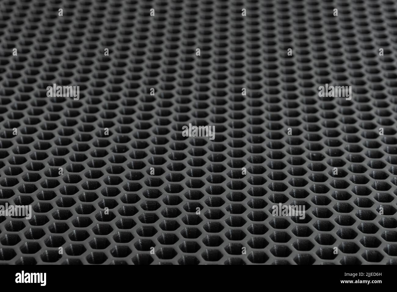Black any panel honeycomb or channel rubber sheet background.Elastic and absorb weight.Made from rubber absorber.Shadow and gredient.View of copy spac Stock Photo