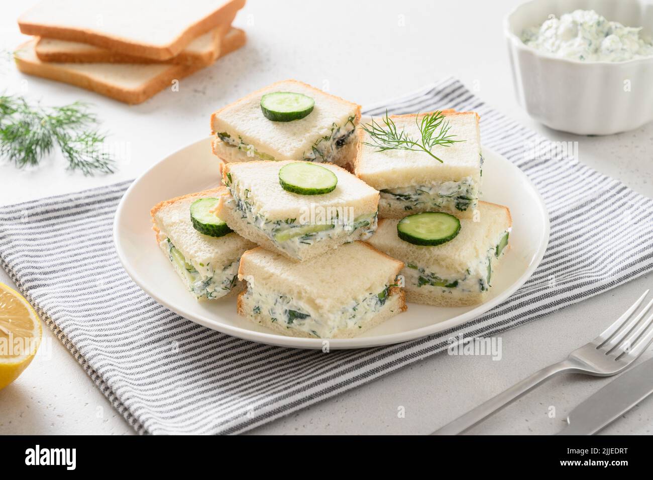 Homemade English tea cucumber sandwiches with ricotta and dill Stock