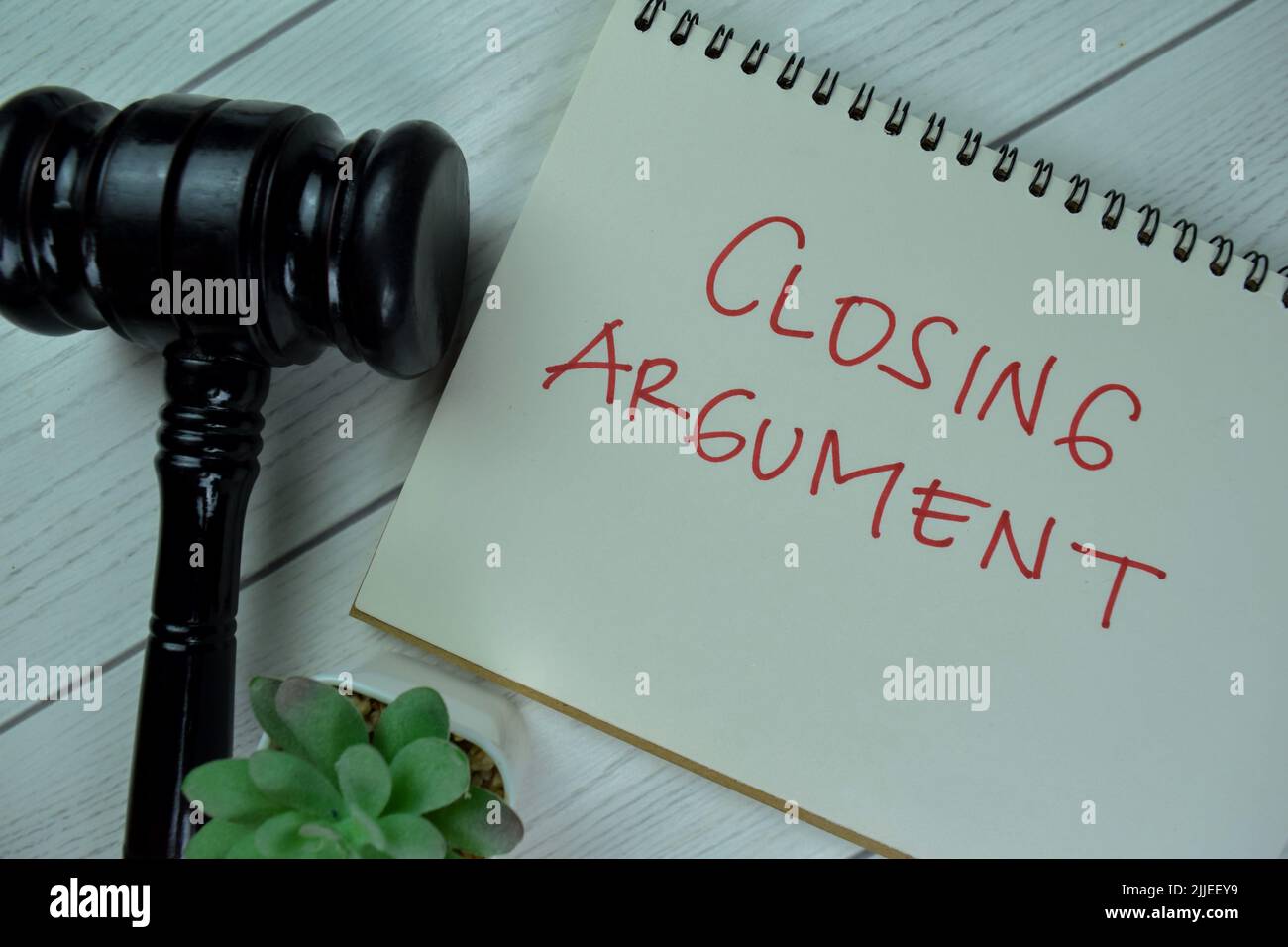 Concept of Closing Argument write on a book with gavel isolated on ...