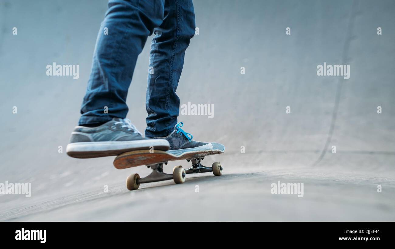 urban skater man skateboard legs jeans ramp Stock Photo