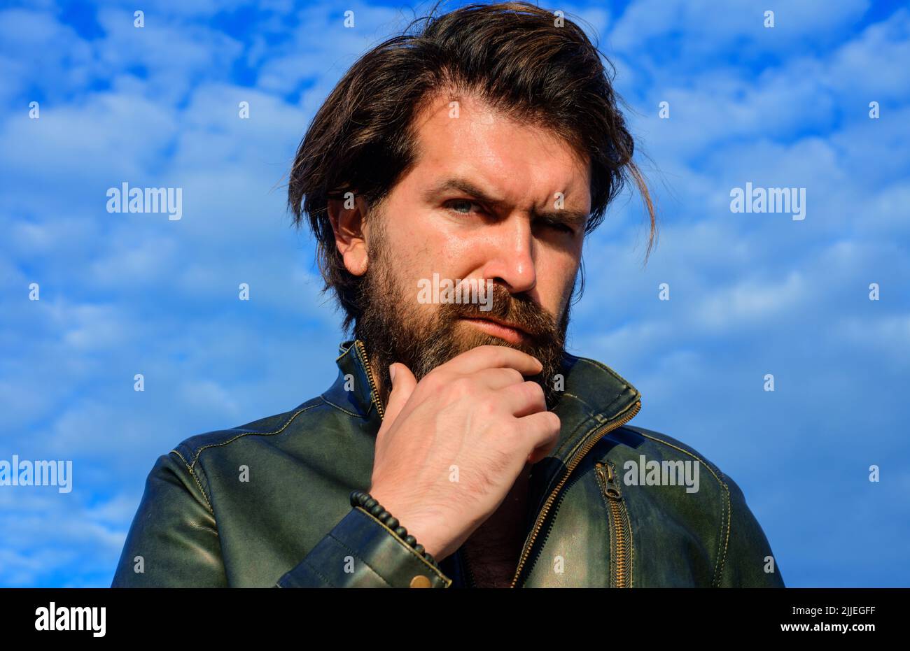 Handsome bearded man in leather jacket. Mens beauty. Fashion male model. Outdoors portrait. Stock Photo