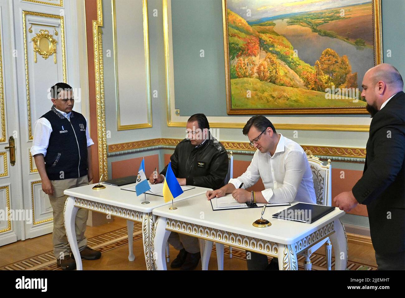 Kyiv, Ukraine. 25th July, 2022. Ukrainian Foreign Affairs Minister Dmytro Kuleba, right, signs a visa waiver agreement with Guatemalan Foreign Minister Mario Bucaro, left, at the Mariinskyi Palace, July 25, 2022 in Kyiv, Ukraine. Credit: Ukrainian Presidential Press Office/Ukraine Presidency/Alamy Live News Stock Photo