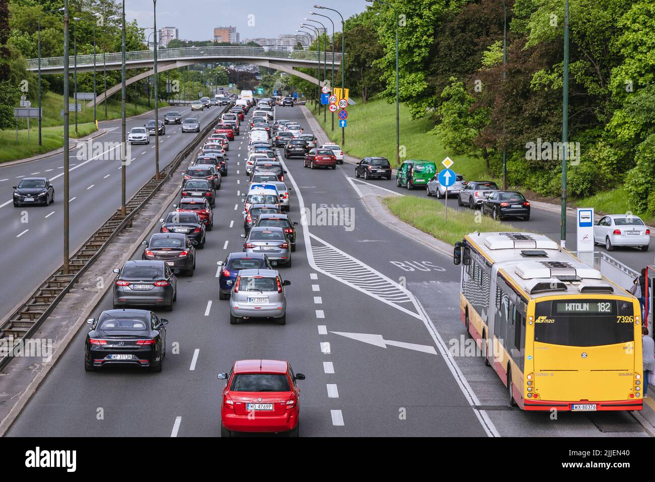 View on the cars driving along Trasa Lazienkowska Street in Warsaw city, Poland Stock Photo